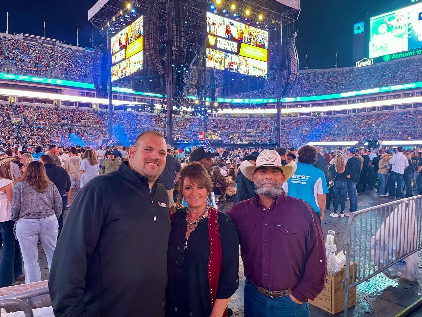 Michele and Mike Toberer and a business man