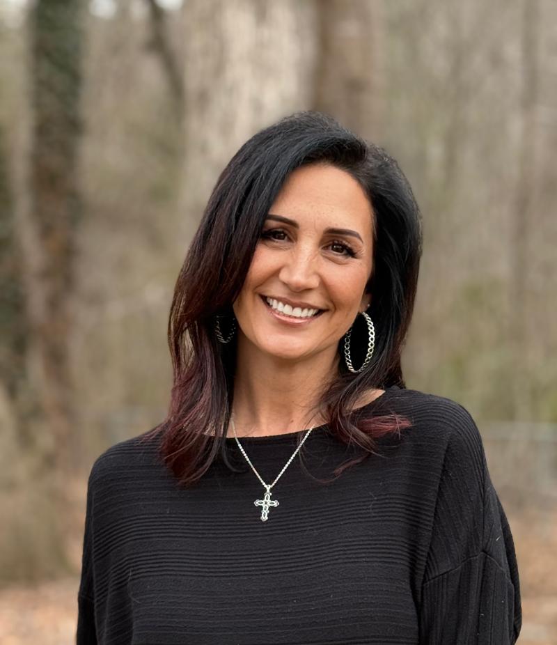 Woman wearing black turtle neck sweater