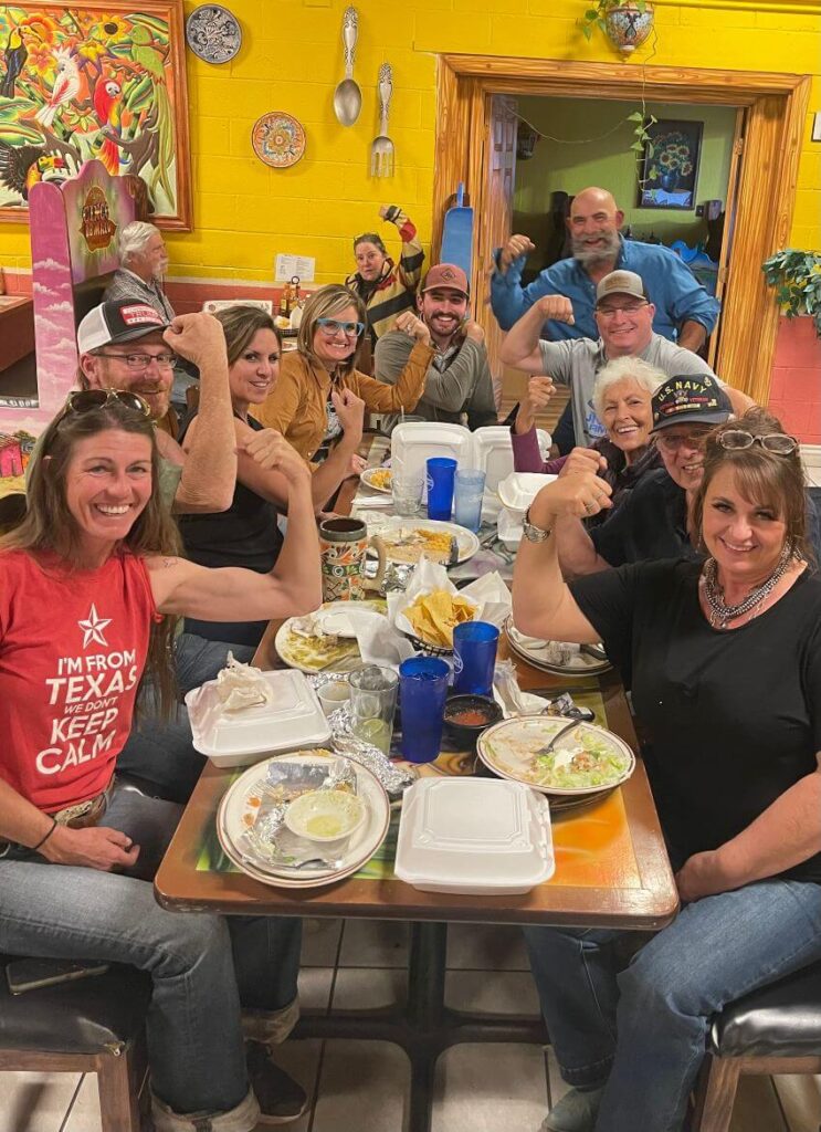 Mission Mules Volunteers Group of volunteers sharing a meal