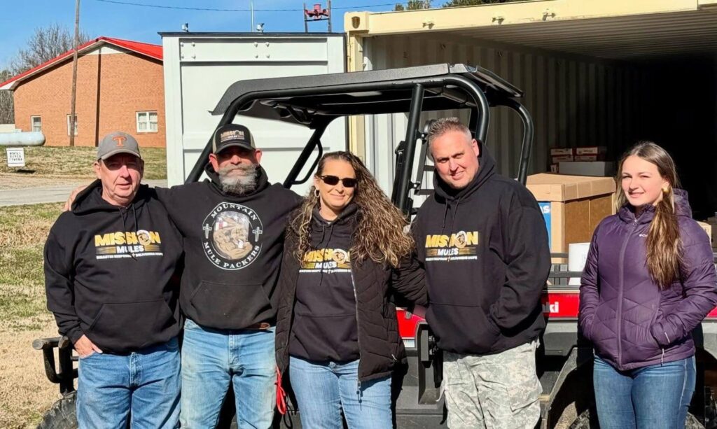 five volunteers loading truck