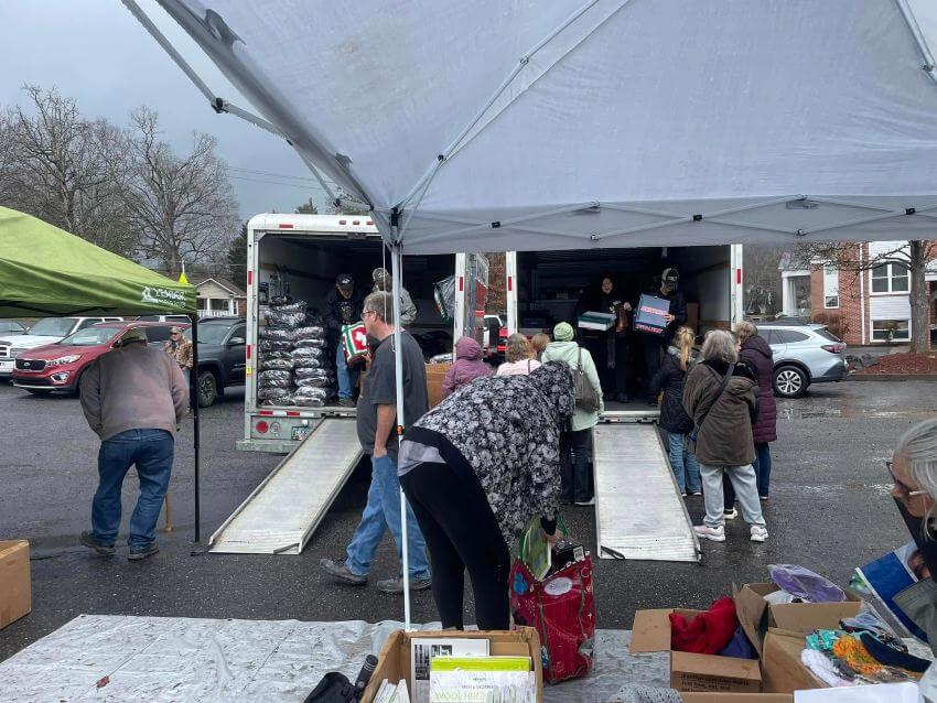 Volunteers unloading truck