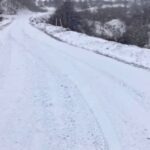 Photo of snowy but plowed West Virginia road