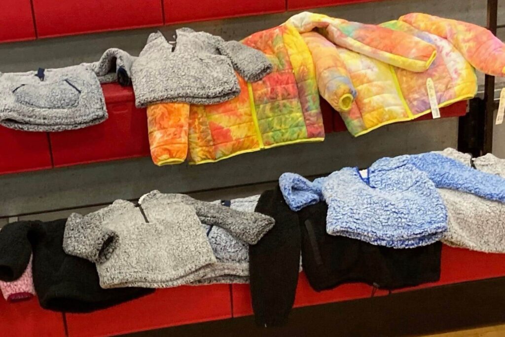 Rows of colorful winter coats for children