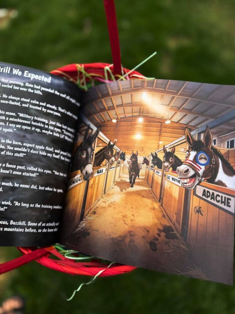 Two book pages opened up, one with illustration of mules in barn stalls